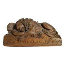 Wooden carved statue of the dying lion of Lucerne