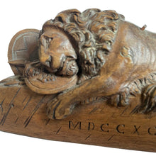 Wooden carved statue of the dying lion of Lucerne
