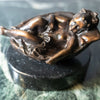 Small bronze baby in basket
